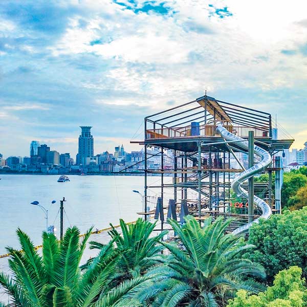 KristallTurm KT-13 High Ropes Course called Magic Jungle at the port of Shanghai with the skyline of the city in the background